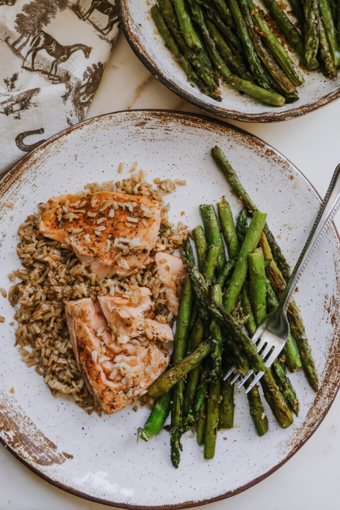 Plate of salmon, rice, and pan fried asparagus for an easy weeknight dinner