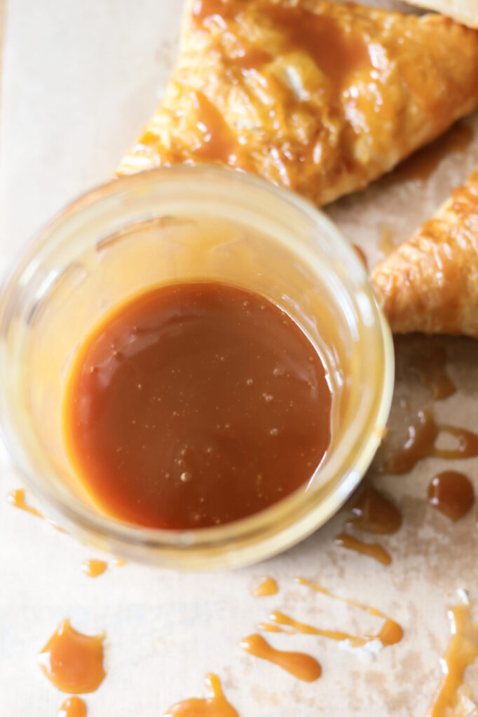 Homemade caramel sauce in a glass jar