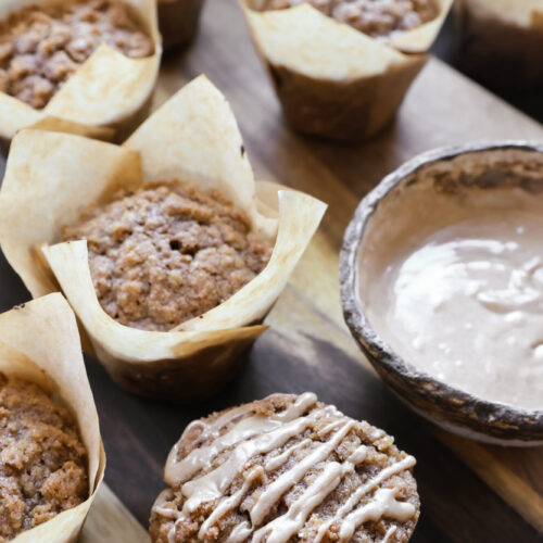 Homemade pumpkin muffins topped with brown sugar streusel and light glaze, ready to serve
