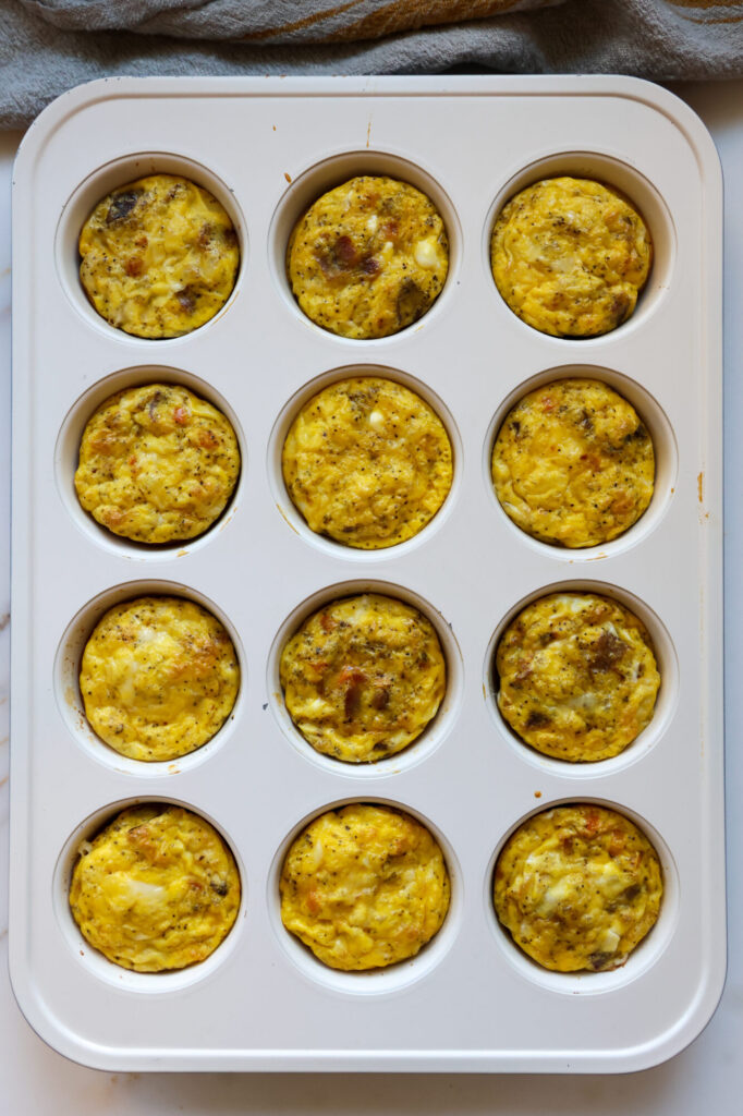 Cottage cheese egg bites baked in non-toxic muffin tin – fluffy texture, cheesy goodness, and high-protein breakfast perfect for busy mornings.