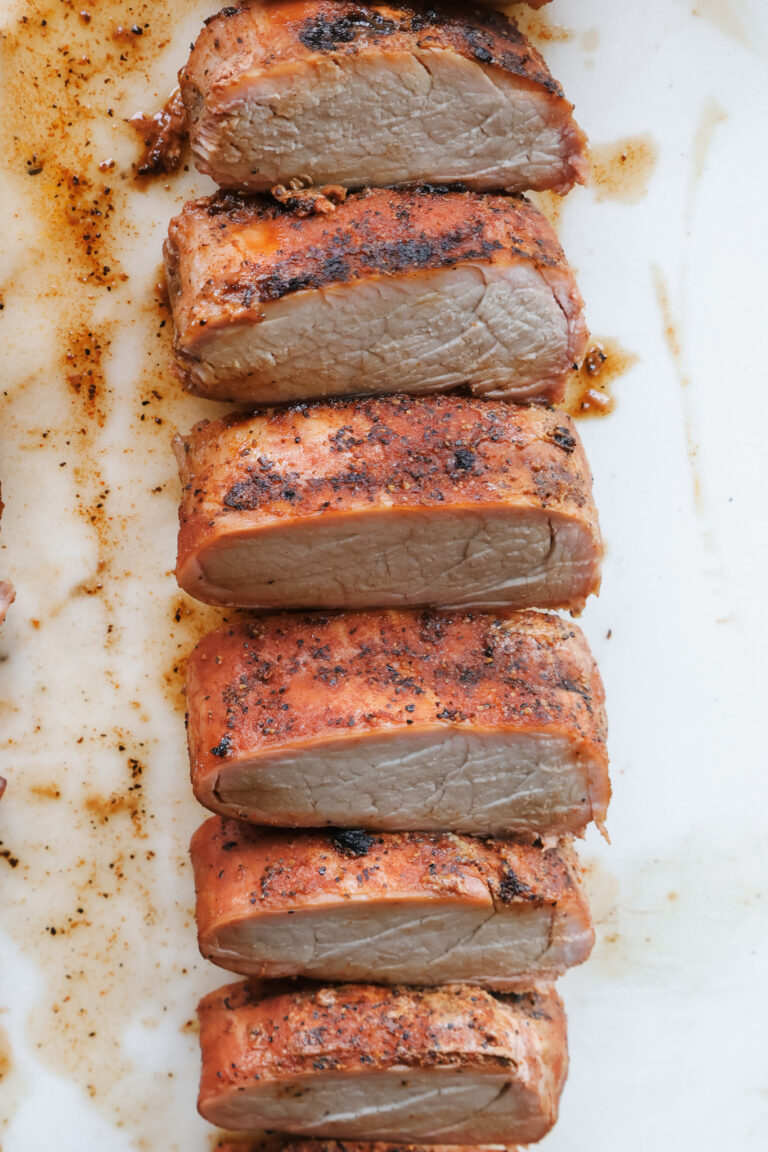 Juicy slices of smoked pork tenderloin cooked to 145 degrees internal temperature.