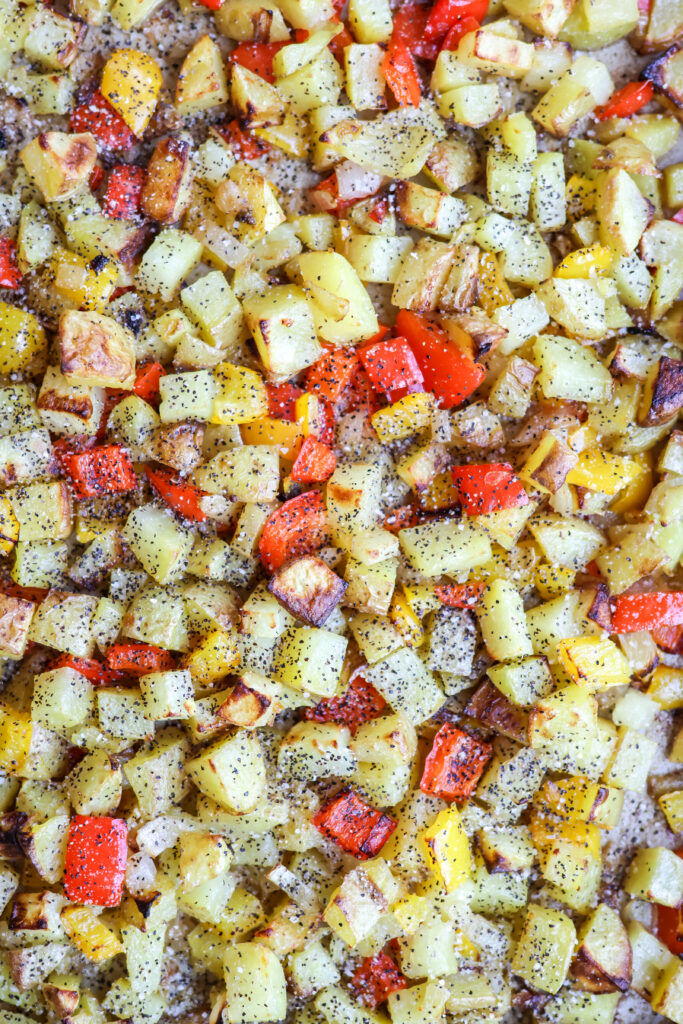 Golden crispy breakfast potatoes with roasted red and yellow bell peppers