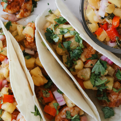 Juicy seared shrimp piled into warm tortillas with a spoonful of sweet, tangy pineapple salsa.