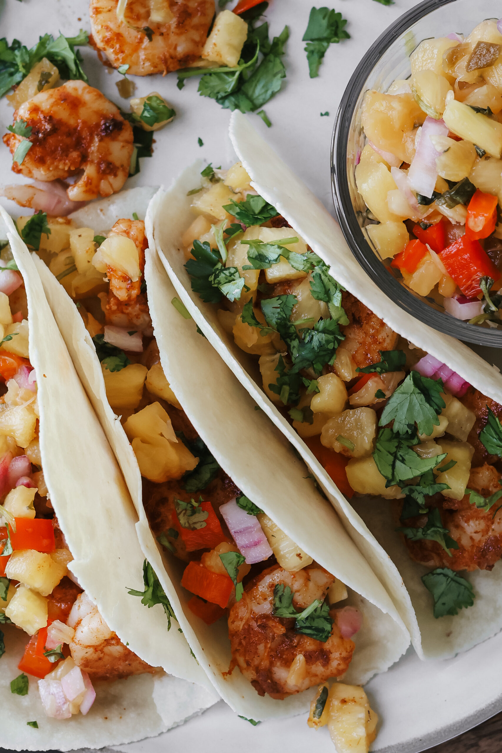 Juicy seared shrimp piled into warm tortillas with a spoonful of sweet, tangy pineapple salsa.