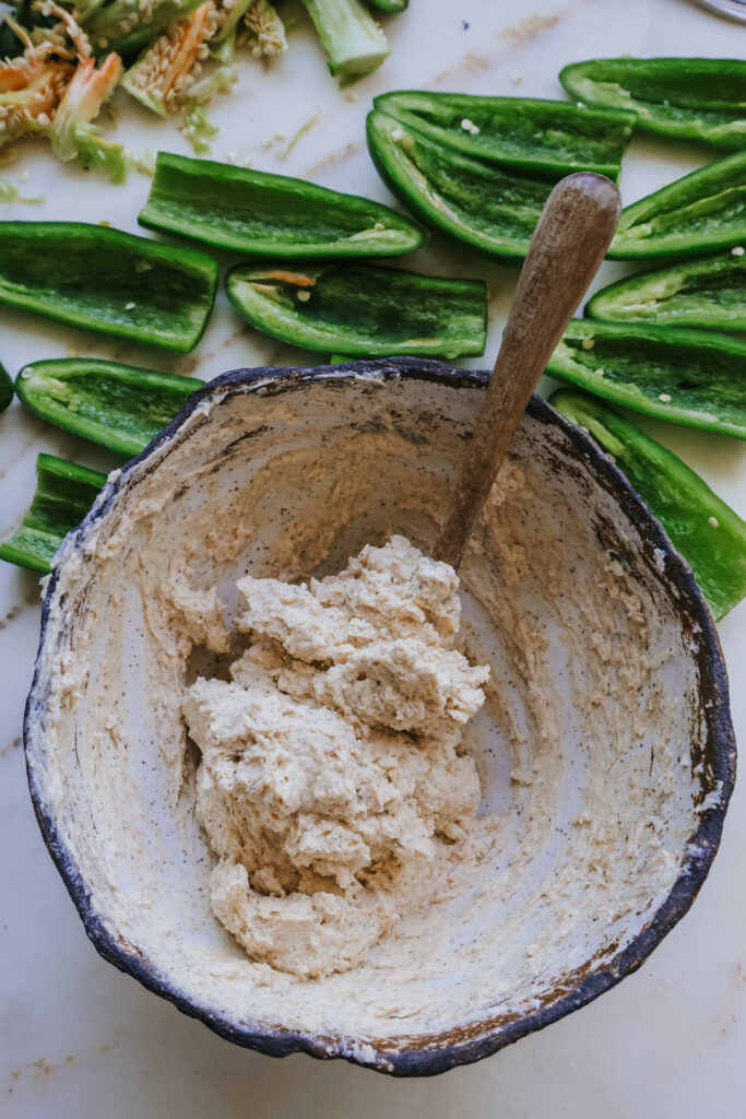 Smooth cream cheese filling mixed with spoon for air fryer bacon wrapped jalapenos